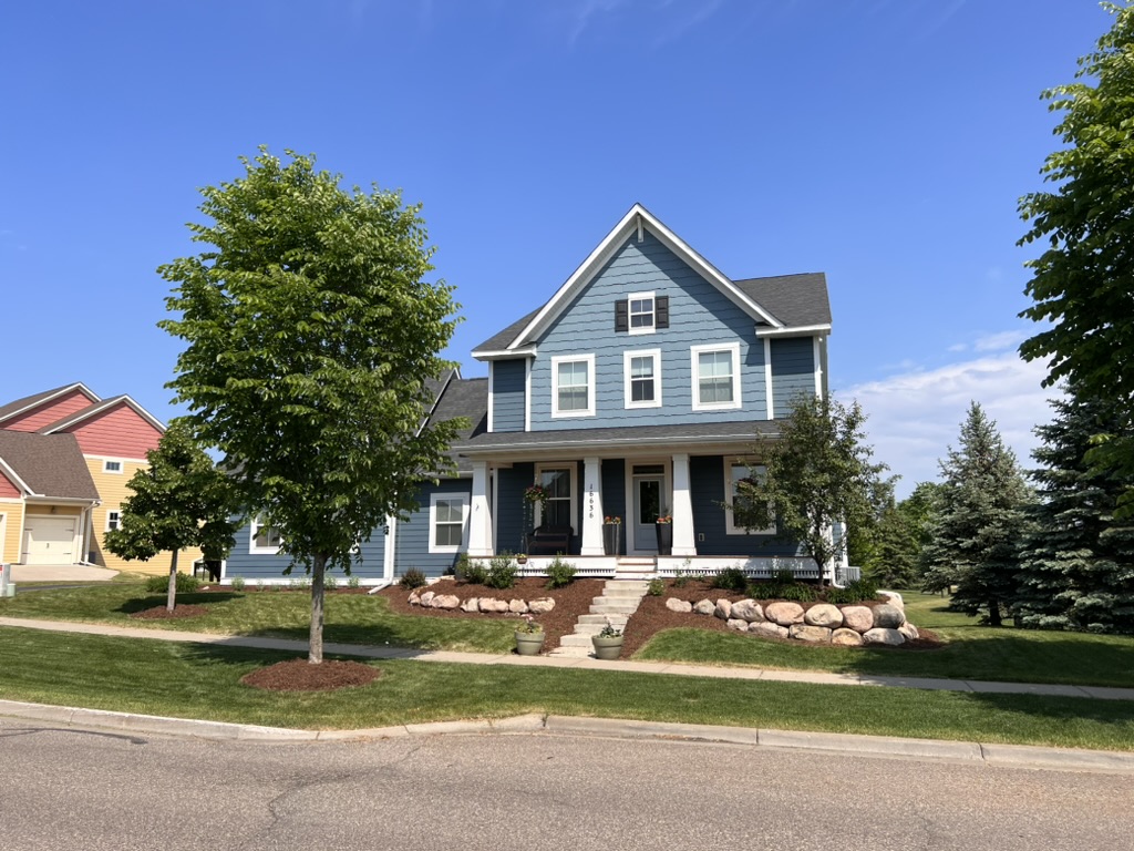 Front view of 16636 Eagleview Dr, a blue craftsman home in Lakeville, Minnesota